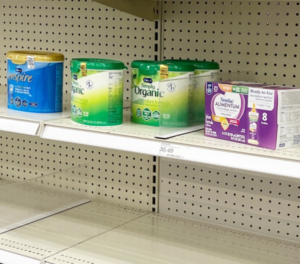 A mostly-empty shelf of infant formula